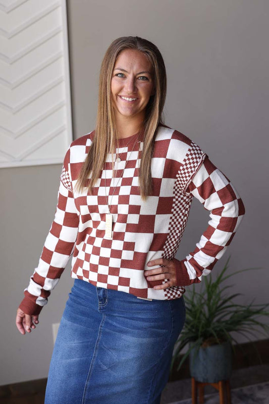 Add a touch of chic to your wardrobe with our Brown Checkered Crewneck Sweater. Soft and stretchy, this sweater is perfect for any occasion - from work to date night to coffee dates. Stay trendy and comfy with the effortless style of our checked print sweater!