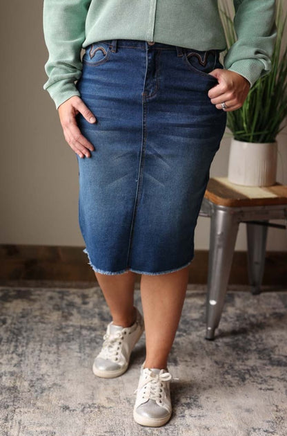 Brown Fray Stitching Pencil Denim Skirt. The medium wash adds a touch of character, while the heavy brown fray stitching on the pockets gives off a casual and effortless vibe. Classy Closet Modest Women's Clothing and Cute Spring Outfits
