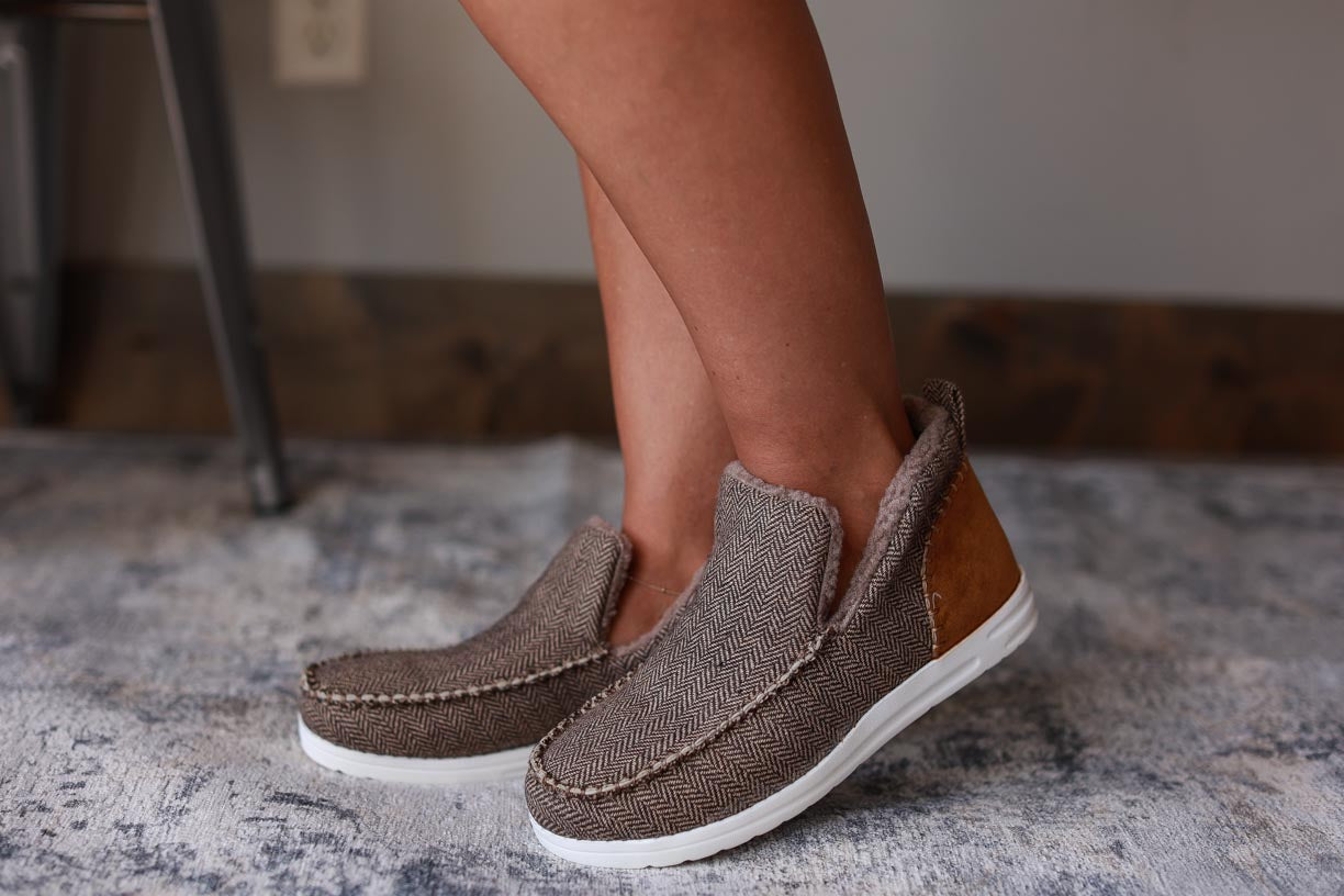 Stay warm and stylish this winter with the Brown Everyday Slip On Shoe. Featuring a fur-lined design and side slits for improved air flow, this shoe is your go-to for both comfort and style. Perfect for everyday wear, you won't sacrifice comfort for style with these slip on shoes.