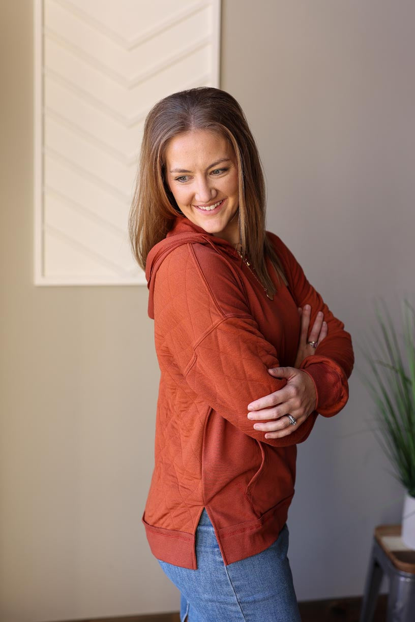 Introducing the Chestnut Quilted Hoodie - a must-have for your wardrobe! The quilted back and sleeve detail adds a unique touch, while the solid front and kangaroo pocket provide convenience. Classy Closet modest women's online shop