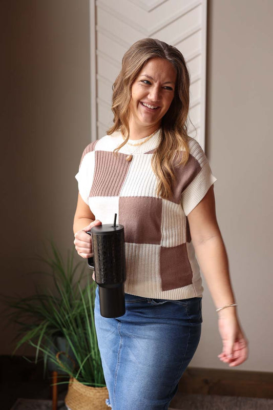 This Deep Khaki Checkered Short Sleeve Sweater is a fun, easy transition piece that provides both trendy style and comfort! Layer a long sleeve tee underneath for colder days, then enjoy the versatility of the short sleeves as the season changes. Perfect for work, school, and coffee dates! Classy Closet online women's boutique clothing store for cute trendy affordable tops and modest fashion denim skirts. 
