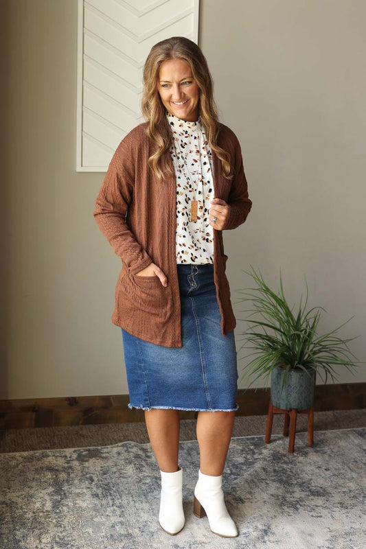Stay cozy and stylish this fall/winter with our Coffee Textured Open Front Cardigan! With front pockets and a longer length, this versatile piece is perfect for any occasion. Dress it up or down and complete endless outfits with just one cardigan. Stay fashionable and functional at home, work, or church. Classy Closet cute fall winter cardigan for women, moms at home work church