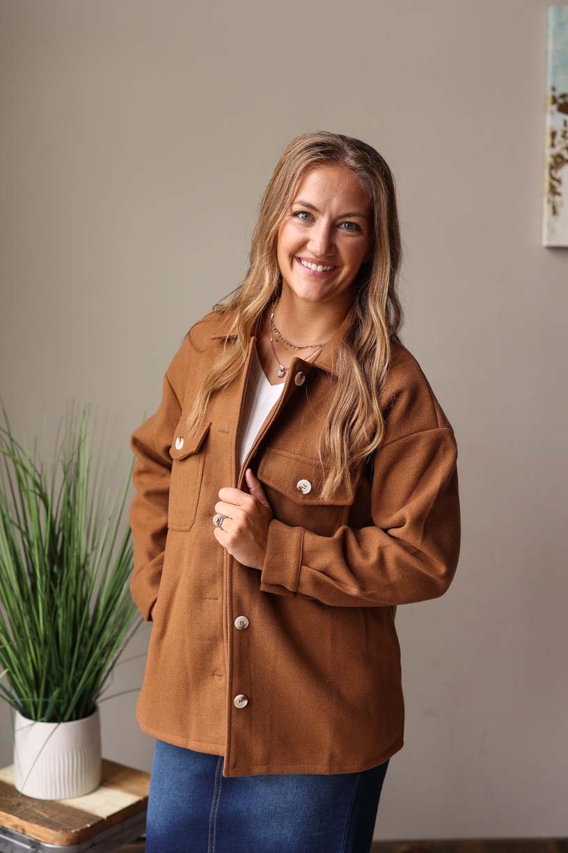 Our must-have Camel Button-Up Coat is a true style essential for your winter wardrobe. This timeless piece has a perfect balance of functionality and sophistication with its convenient pockets from Classy Closet Online Women's Clothing Boutique Near ME