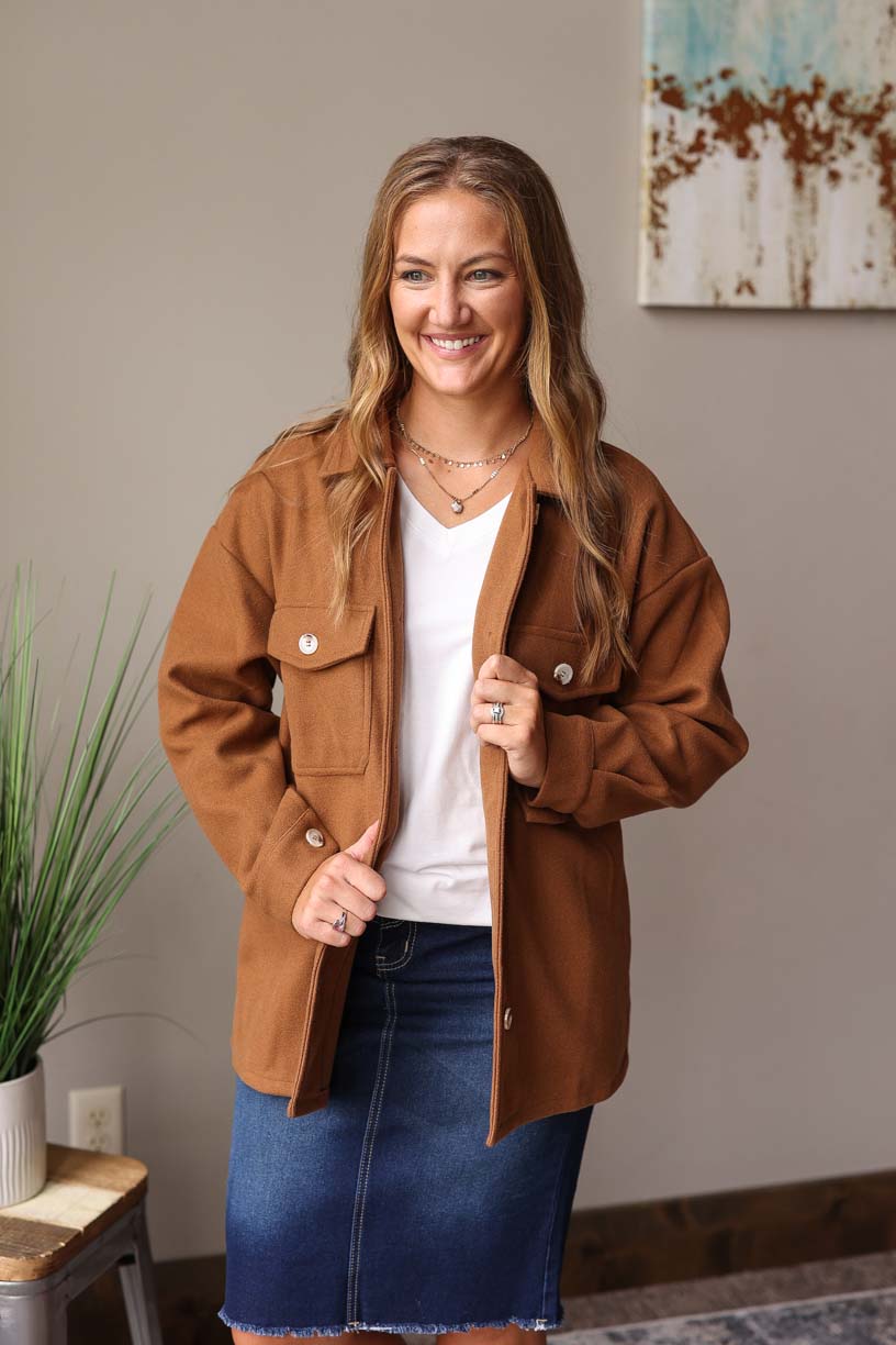 Our must-have Camel Button-Up Coat is a true style essential for your winter wardrobe. This timeless piece has a perfect balance of functionality and sophistication with its convenient pockets from Classy Closet Online Women's Clothing Boutique Near ME