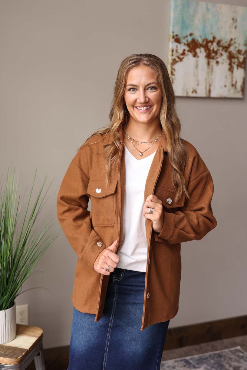 Our must-have Camel Button-Up Coat is a true style essential for your winter wardrobe. This timeless piece has a perfect balance of functionality and sophistication with its convenient pockets from Classy Closet Online Women's Clothing Boutique Near ME