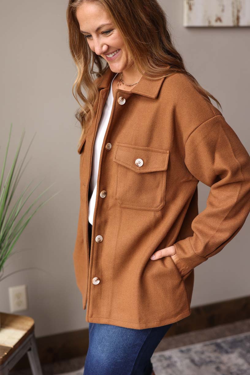 Our must-have Camel Button-Up Coat is a true style essential for your winter wardrobe. This timeless piece has a perfect balance of functionality and sophistication with its convenient pockets from Classy Closet Online Women's Clothing Boutique Near ME