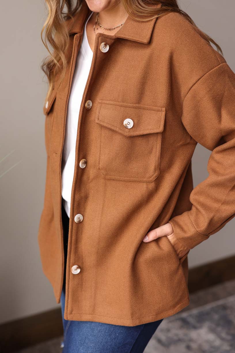 Our must-have Camel Button-Up Coat is a true style essential for your winter wardrobe. This timeless piece has a perfect balance of functionality and sophistication with its convenient pockets from Classy Closet Online Women's Clothing Boutique Near ME