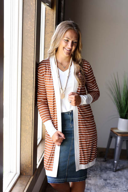 Look effortlessly chic all year round with this Camel Ivory Striped Pocket Cardigan. Made from lightweight material, it lays nicely and is comfortable to wear. Classy Closet Women's Fall Winter Fashion Boutique