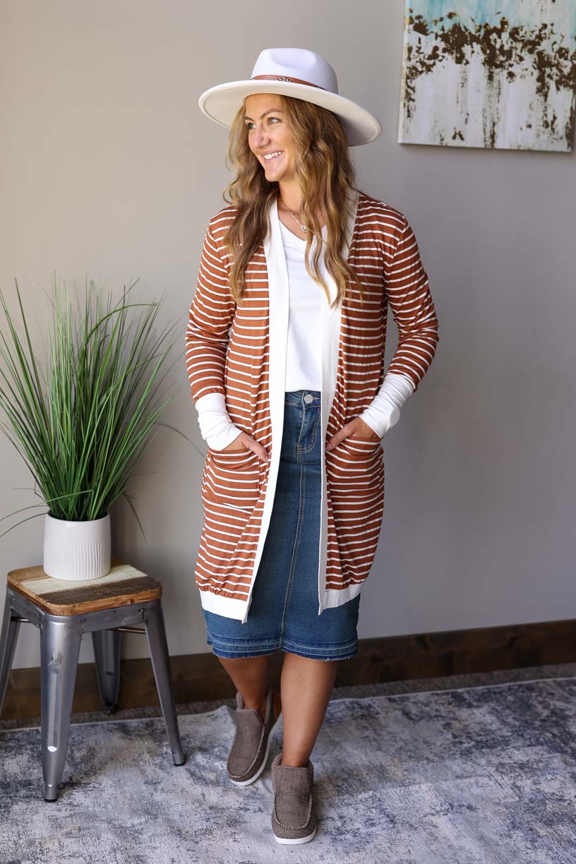Look effortlessly chic all year round with this Camel Ivory Striped Pocket Cardigan. Made from lightweight material, it lays nicely and is comfortable to wear. Classy Closet Women's Fall Winter Fashion Boutique