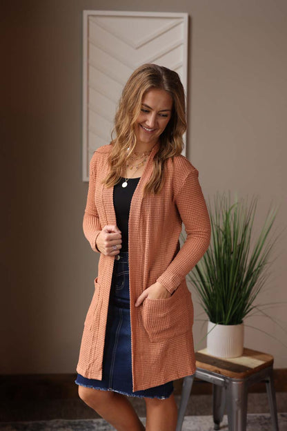 Brown Waffle Cardigan is an effortless and chic way to dress up any outfit. Made with comfortable and waffle knit material, this cardigan is perfect for transitioning between seasons at Classy Closet WOmen's Online Boutique Near Me