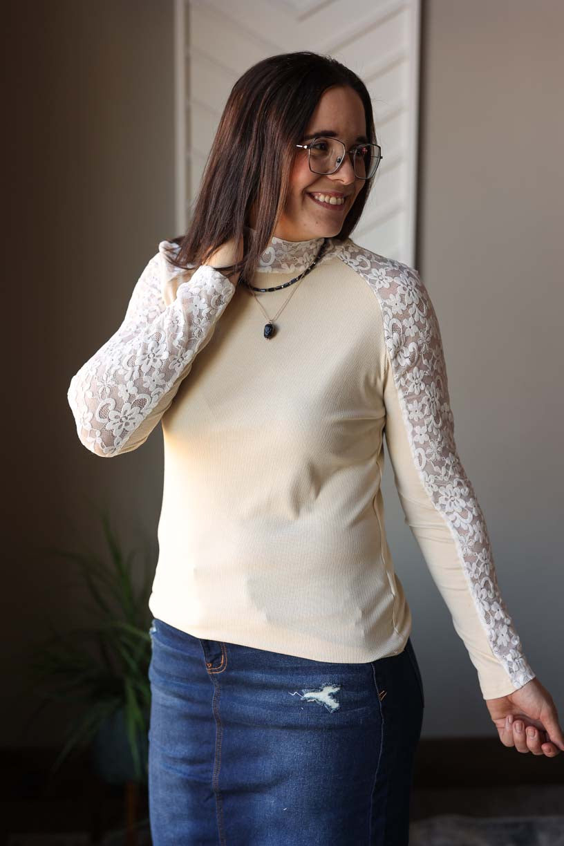 Elevate your style with our Beige Floral Lace Long Sleeve Top. This chic and trendy top features a subtle ribbed body, lace long sleeves, and slight mock neck. Perfect for layering or wearing alone, it's versatile and adds a touch of style to any outfit. Size up two for a fashionable look, as shown, or size up one for a more fitted, layering piece. Classy Closet online women's boutique clothing store with cute trendy and modest fashion style for everyday mom outfits, teacher outfits, and church outfits.
