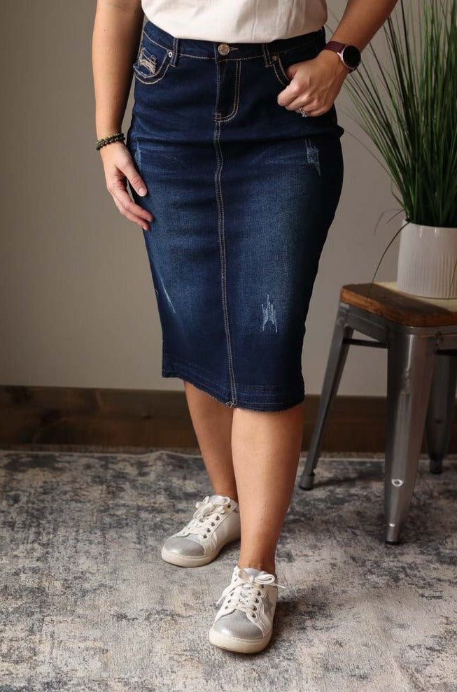 uplevel your wardrobe with our Brown Line Stitching Midi Denim Skirt! With its dark wash denim and thick brown line stitching details on the pockets, this skirt effortlessly adds a touch of style to any outfit. Classy Closet Modest Women's Clothing for Cute Affordable Fashion