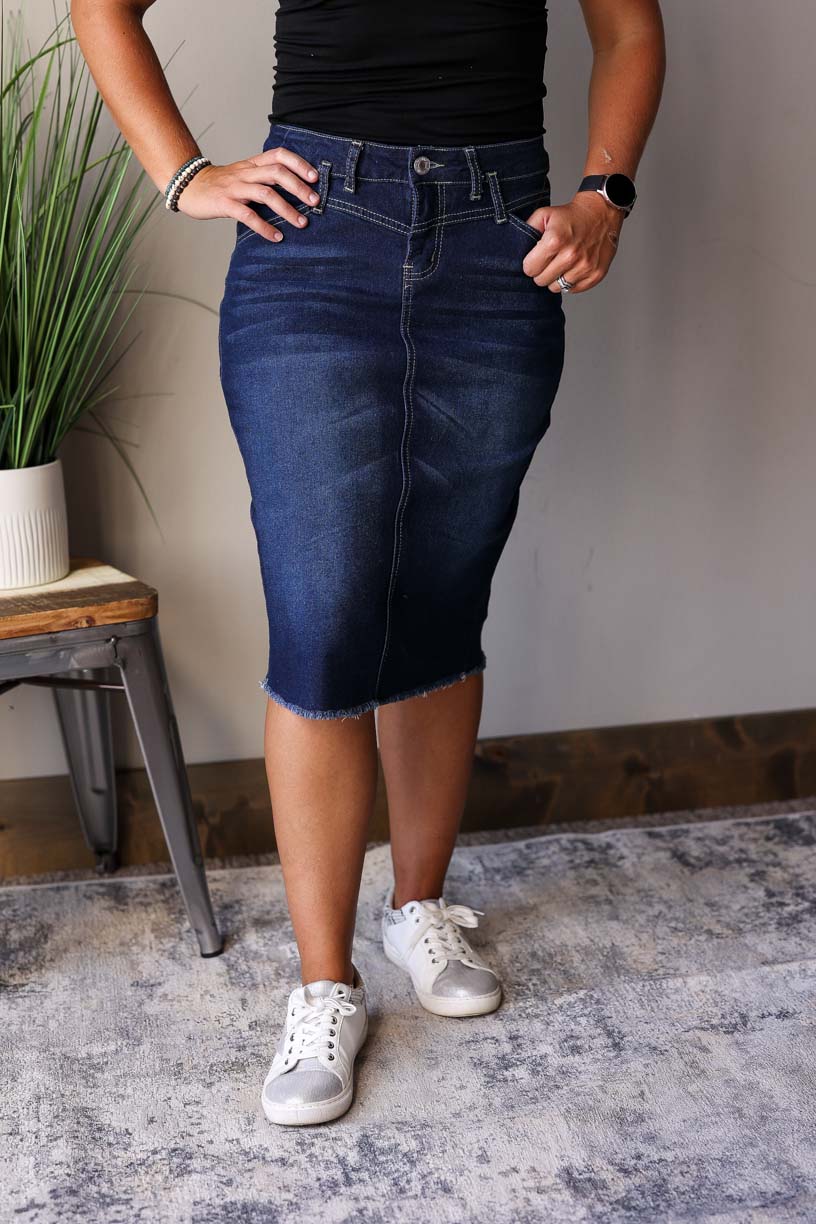 Sophia Dark Wash Skirt is perfect for any occasion from date nights to the office. It is made with a dark wash for a chic look and features a feminine waist stitching detail for fall winter fashion.