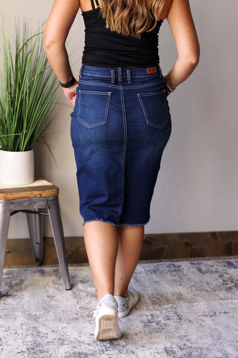 Sophia Dark Wash Skirt is perfect for any occasion from date nights to the office. It is made with a dark wash for a chic look and features a feminine waist stitching detail for fall winter fashion.