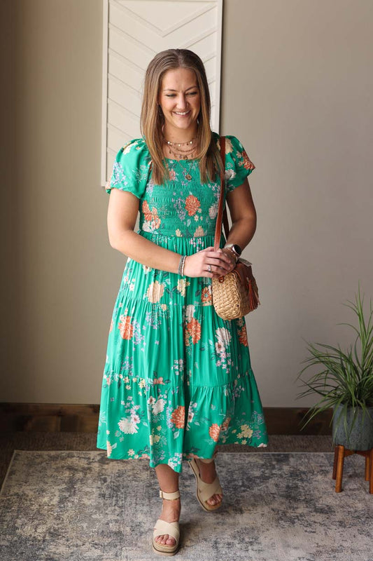 Look effortlessly chic in our Green Floral Smocked Midi Dress. The puff sleeves and elastic neckline add a touch of femininity, perfect for the summer season. Stay cool and stylish with this super cute dress. Classy Closet Boutique Dresses for Modest Fashion