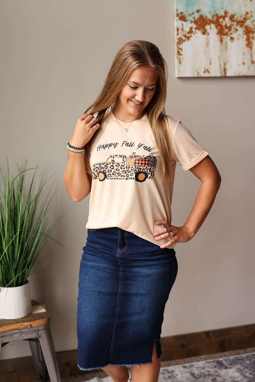 This Happy Fall Y'all Graphic Tee is perfect for any autumn occasion. Featuring a "Happy Fall Y'all" graphic and a leopard print pickup with pumpkins at Classy Closet Fall Fashion Women's Boutique Near Me