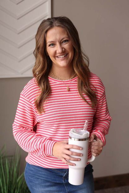Stay chic and vibrant in our Rose Stripe Crewneck Top. Made from comfortable waffle knit, this hot pink and white striped top will bring a feminine touch to your wardrobe. Versatile for any occasion, dress it up or down for everyday style. Classy Closet online womens clothing boutique for cute mom outfits, everyday style, and modest fashion. Hull, Iowa