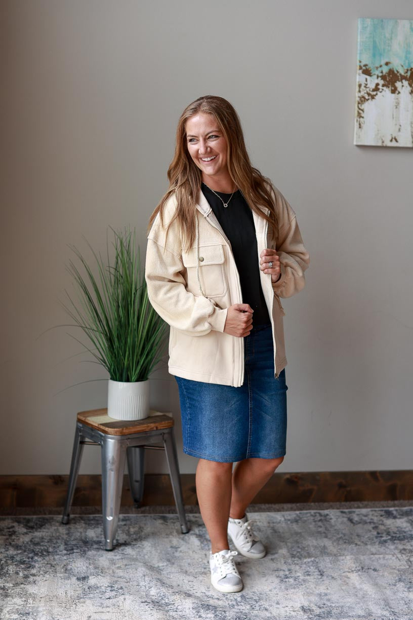 Ivory Hooded Zip Up Jacket. Made with ivory two-tone fabric with a drawstring hood, this jacket ensures maximum coziness and a timelessly trendy look. Beat the chill in style and keep cozy all season long! Classy Closet WOmen's Boutique Near Me