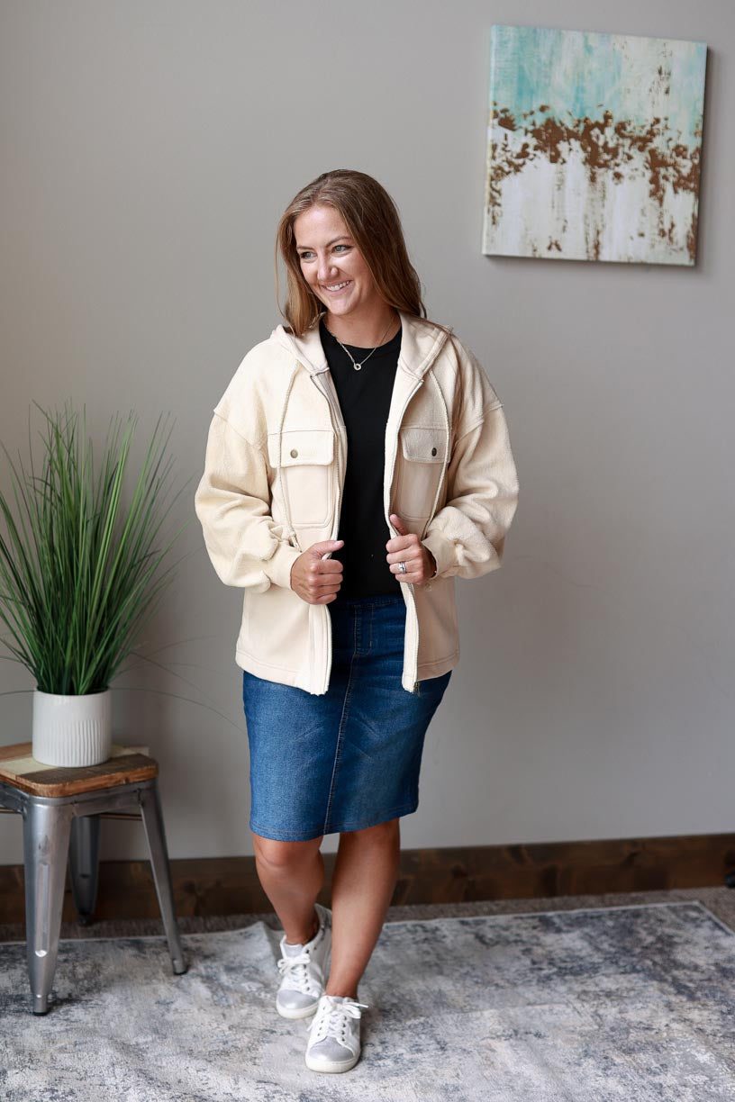 Ivory Hooded Zip Up Jacket. Made with ivory two-tone fabric with a drawstring hood, this jacket ensures maximum coziness and a timelessly trendy look. Beat the chill in style and keep cozy all season long! Classy Closet WOmen's Boutique Near Me
