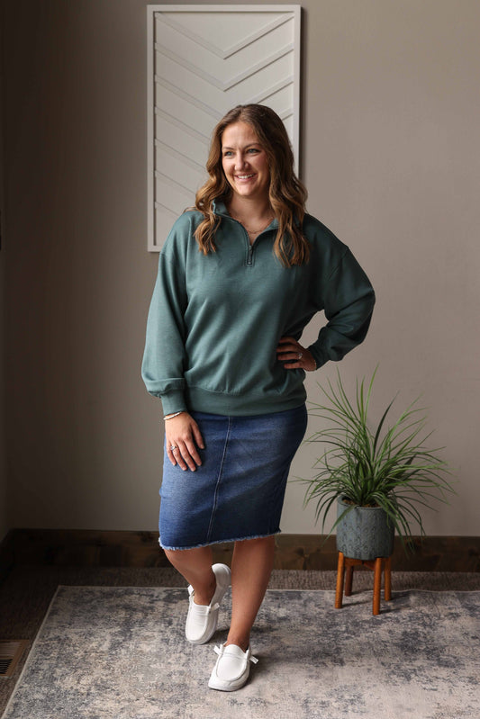 This Jade Scuba Quarter Zip Pullover is the perfect lightweight layer for any day. Its smooth, almost slick fabric feels great against your skin, while the quarter zip neck lets you adjust your comfort. Hidden side pockets keep your essentials close without adding bulk. Easy to wear and effortlessly stylish, it’s a cozy choice for casual outings or relaxing at home.