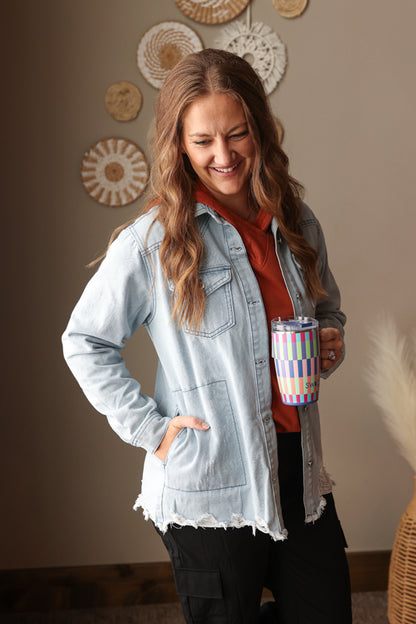 Sky blue flap pocket fray hem denim shirt jacket styled for a casual winter spring outfit