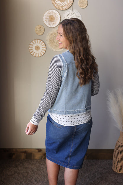 Casual women’s denim vest jacket worn as a lightweight layering piece