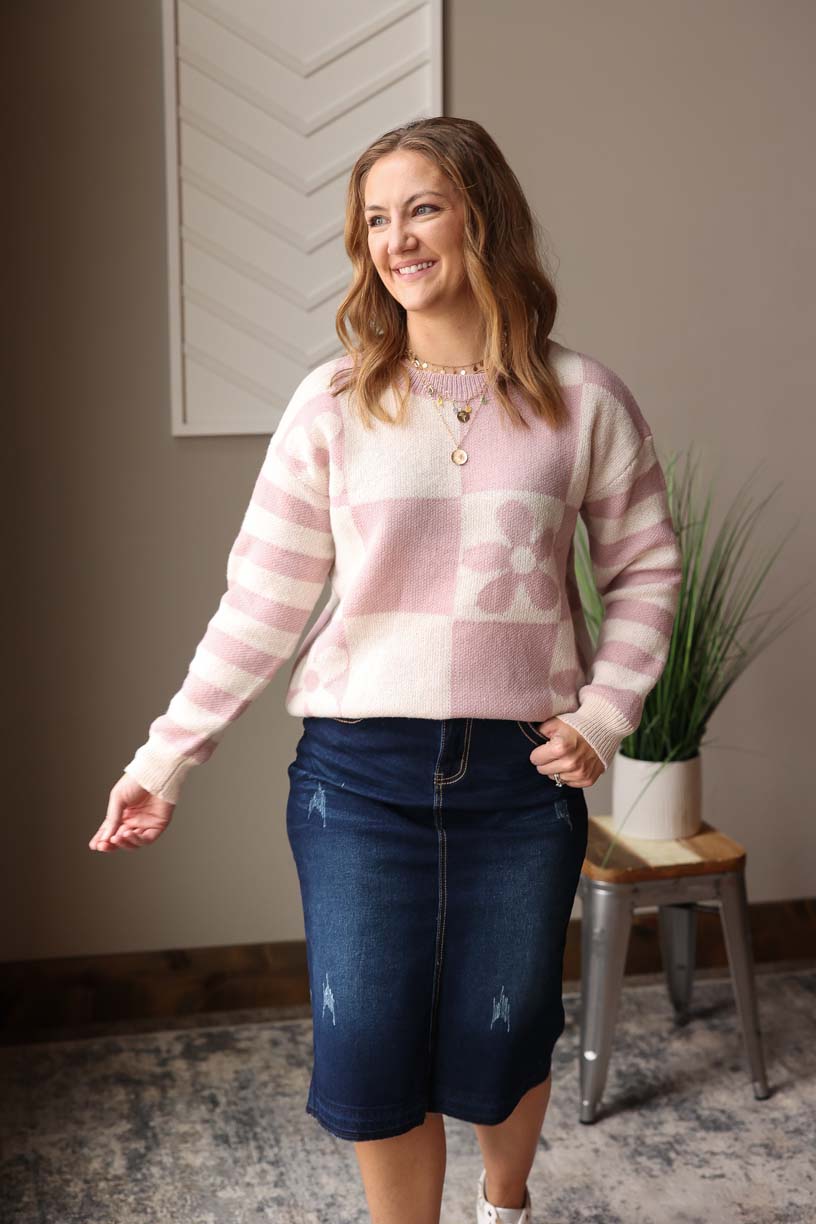 Stay cozy and cute in our Orchid Petal Checkered Floral Sweater! With a subtle pop of lavender/pink tone, this sweater features daisy florals, stripes, and checkered prints for a fun and cheerful look. Perfect for adding a touch of happiness to your wardrobe. Classy Closet is here to help you look and feel good in your everyday casual spring outfits!