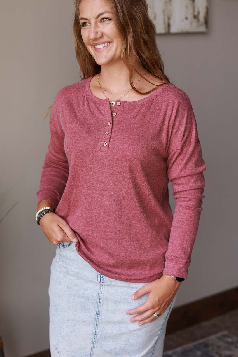 Our Dark Mauve Henley Top is perfect for everyday wear. Made for comfort, it features a henley neckline and stretchy, soft fabric. Available in sizes S-2XL PLUS, this top is an essential for your wardrobe. Classy Closet Women's Modest Fashion Boutique