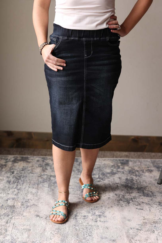 Introducing the Midnight Comfort Black Elastic Stretch Denim Skirt! With its stretchy fabric and elastic waistband, this skirt provides a comfortable and stylish fit. The back slit adds a touch of sophistication. Perfect for all-day wear without sacrificing style.