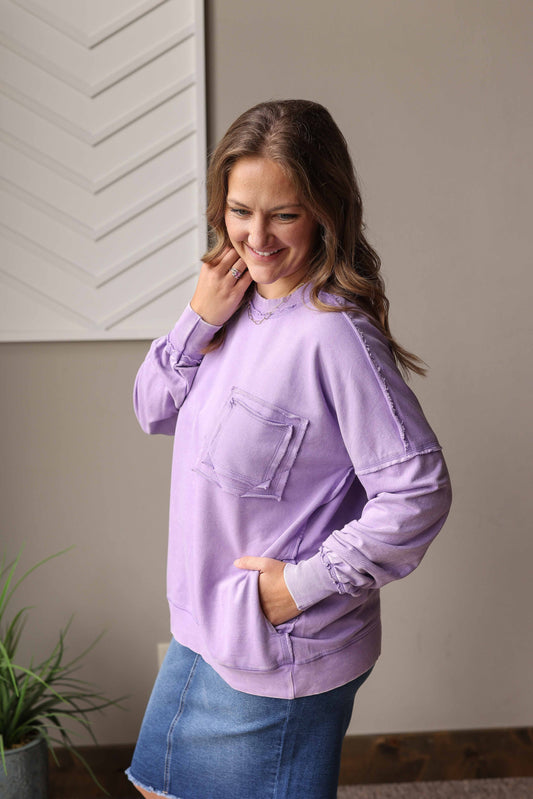Stay cozy and cheerful with the Lavender Acid Wash Crewneck Sweatshirt, perfect for fun summer bonfire nights or early morning coffee moments. Its soft fabric and relaxed fit keep you comfortable while adding a touch of laid-back style to your casual look. Embrace those easy, happy vibes wherever you go!