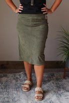 Introducing our Moss Green Corduroy Elastic Waist Skirt - cute, comfy, and perfect for everyday wear! The elastic waistband adds versatility, making it easy to dress up or down. Say hello to your new go-to skirt! Classy Closet online women's midi skirt store boutique for women's modest fashion 2024.