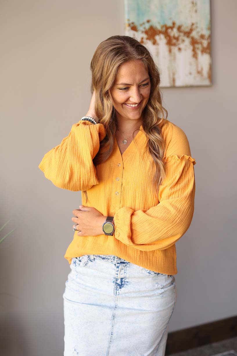 Our Mustard Balloon Long Sleeve Crinkled Top is here to make you look and feel amazing! Made with a soft, gauze-like material, this top is so comfortable and breezy that you’ll feel ready to take on the office or a day out with the girls. Who says fashion can’t be comfortable?