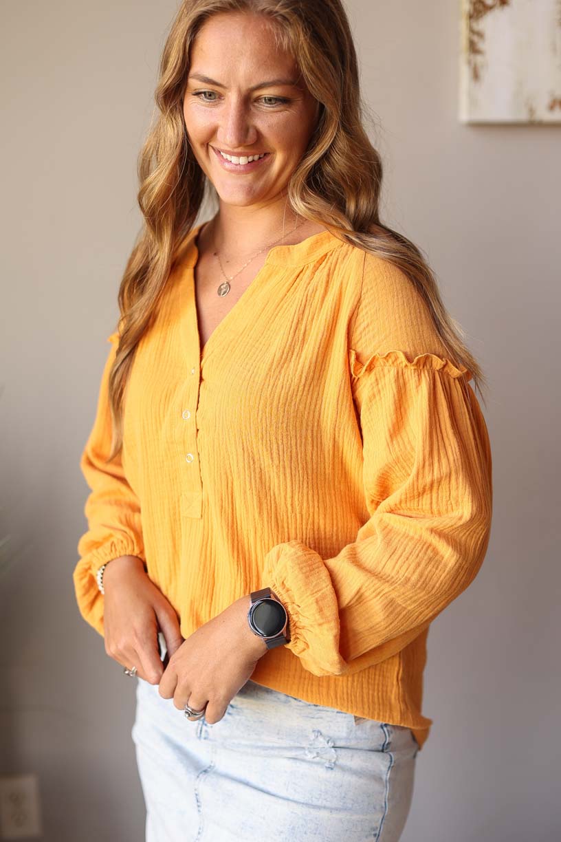 Our Mustard Balloon Long Sleeve Crinkled Top is here to make you look and feel amazing! Made with a soft, gauze-like material, this top is so comfortable and breezy that you’ll feel ready to take on the office or a day out with the girls. Who says fashion can’t be comfortable?