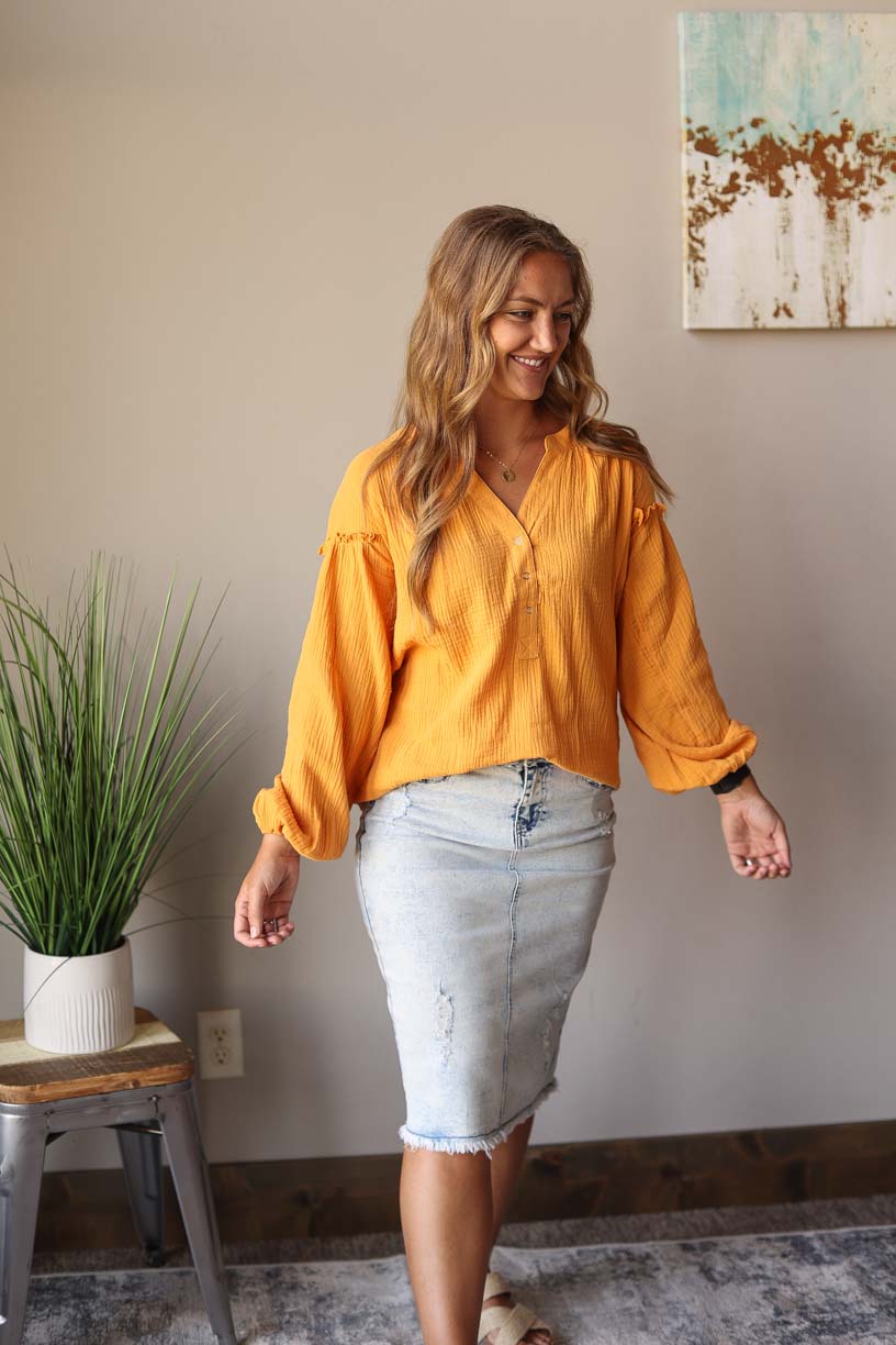 Our Mustard Balloon Long Sleeve Crinkled Top is here to make you look and feel amazing! Made with a soft, gauze-like material, this top is so comfortable and breezy that you’ll feel ready to take on the office or a day out with the girls. Who says fashion can’t be comfortable?