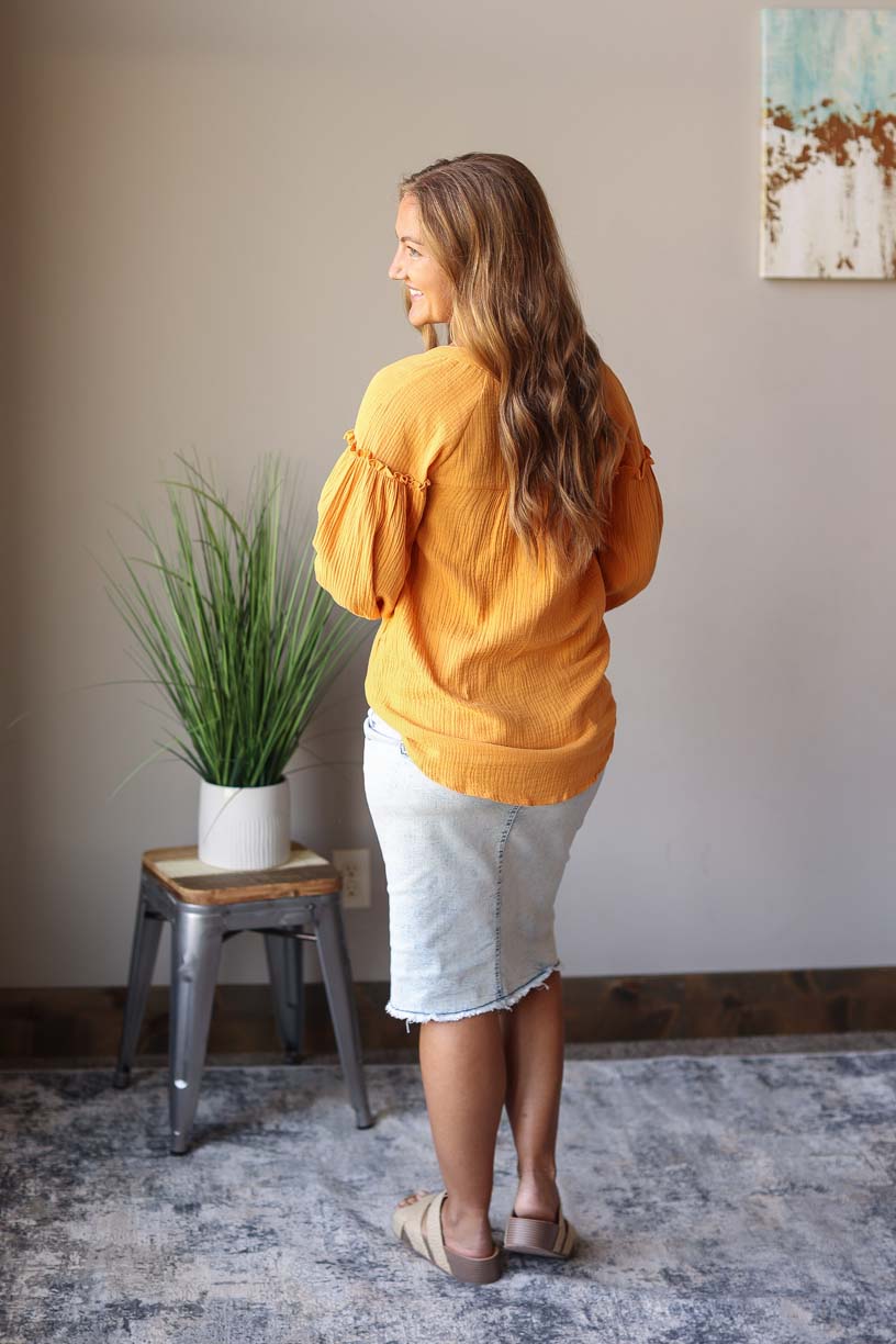 Our Mustard Balloon Long Sleeve Crinkled Top is here to make you look and feel amazing! Made with a soft, gauze-like material, this top is so comfortable and breezy that you’ll feel ready to take on the office or a day out with the girls. Who says fashion can’t be comfortable?