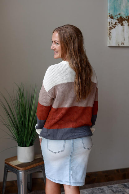 Autumn Colorblock Crewneck Sweater offers comfort and style for any occasion. It features the perfect colors of ivory, rust, blue, and tan for the season. It's designed to fit perfectly, with amazing length without looking bulky at Classy Closet Women's Fashion Boutique Near ME