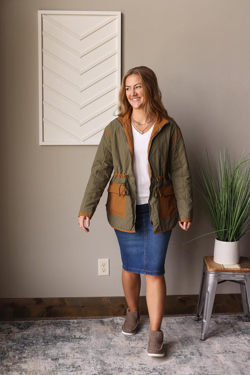 Olive Quilted Jacket, a must-have for your fall winter wardrobe. This mid-weight stunner features cute chestnut pocket and trim details, complete with a drawstring waist function for the perfect fit.  Classy Closet Online Women's CLothing Boutique for Modest Fashion