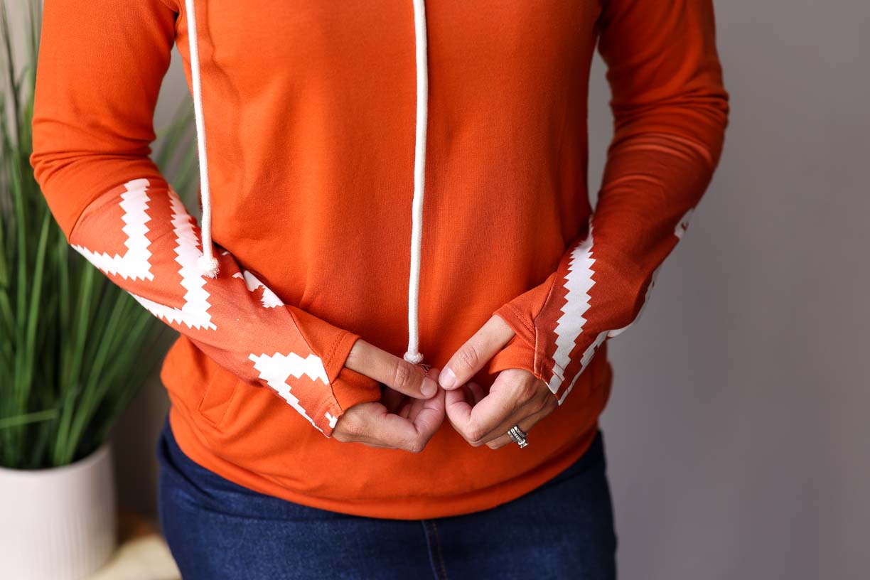 Make fall extra cozy with this Pumpkin Spice Aztec Print Thumb Hole Hoodie! Whether you’re hitting up the pumpkin patch, doing a corn maze, or throwing some leaves around, you won’t be short on style and comfort for fall winter style at Classy Closet Online Women's Boutique.