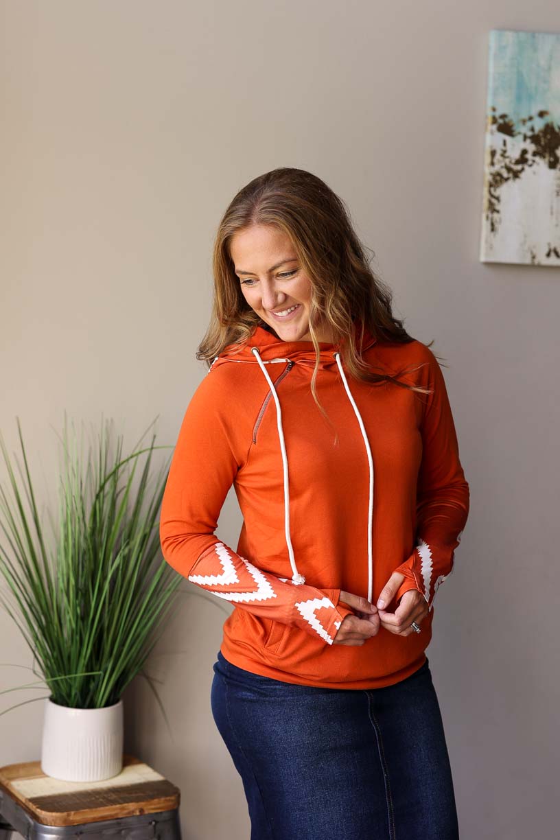 Make fall extra cozy with this Pumpkin Spice Aztec Print Thumb Hole Hoodie! Whether you’re hitting up the pumpkin patch, doing a corn maze, or throwing some leaves around, you won’t be short on style and comfort for fall winter style at Classy Closet Online Women's Boutique.