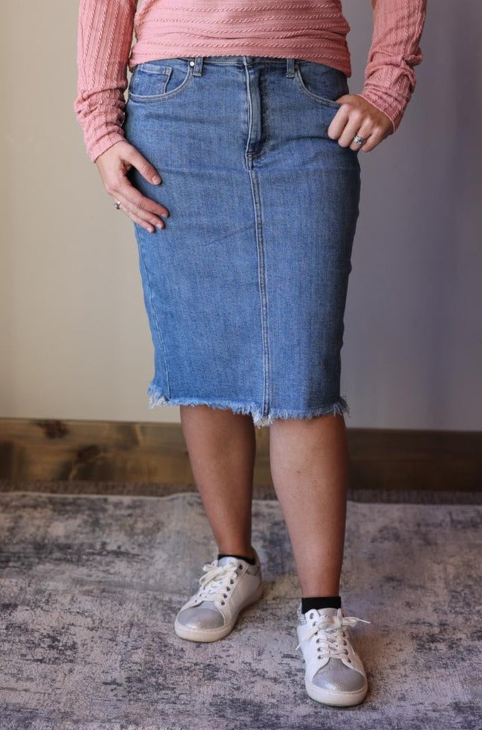 Look stylish and feel comfortable with this Stretch Solid RISEN Denim Skirt. Featuring a back slit, stretch fabric, and slim fit, this best-selling skirt brand is the perfect addition to your modest wardrobe with Classy Closet Online Women's Modest Fashion Boutique.