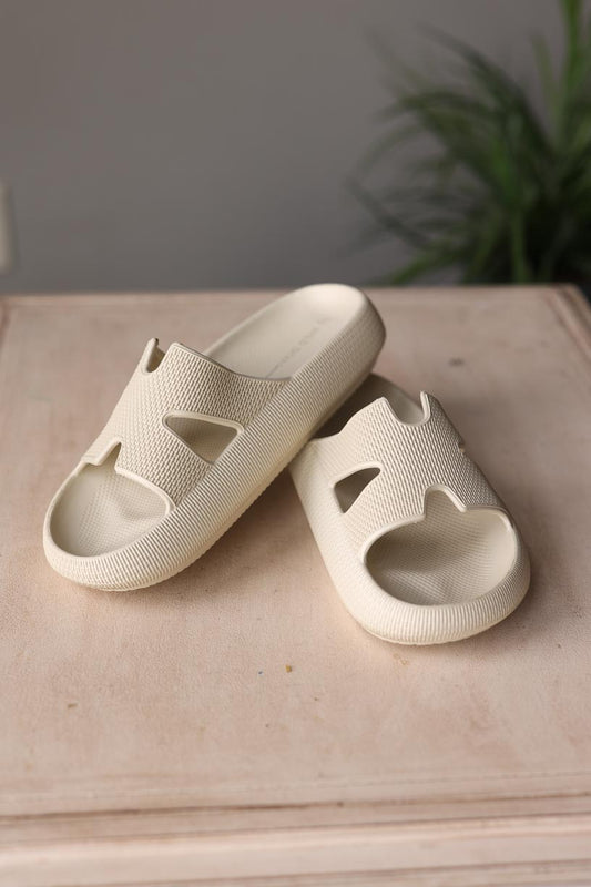 Introducing the Beige H-Slide Waterproof Beach Sandals - the happiest and easiest way to elevate your casual summer outfit. With a unique new design, these slipper shoes are perfect for any occasion - from the beach to the pool to the garden and more! Stay stylish and chic all summer long. Classy Closet Modest Clothing Boutique Iowa