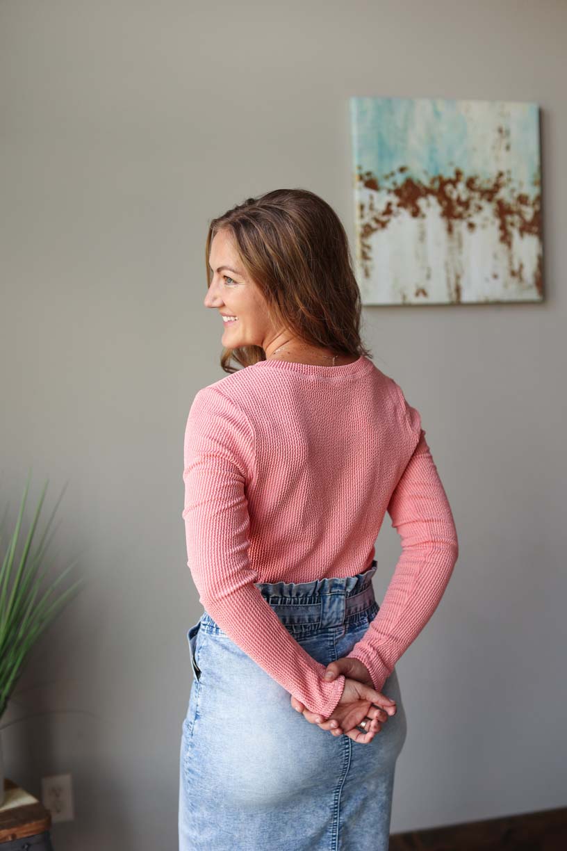 Front view of coral textured long sleeve henley top, perfect for a stylish and comfortable fall outfit at Classy Closet, a women's online modest fashion clothing boutique in Iowa.