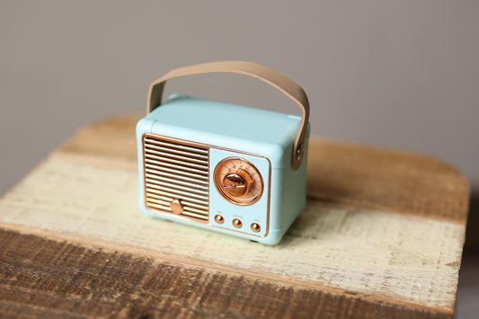 Introducing the Blue Mint Retro Mini Wireless Bluetooth Speaker - not only does it deliver great sound, but it also adds a touch of cute retro style to any desk or office space. Enjoy your music with this adorable speaker, or use it as a fun decoration.