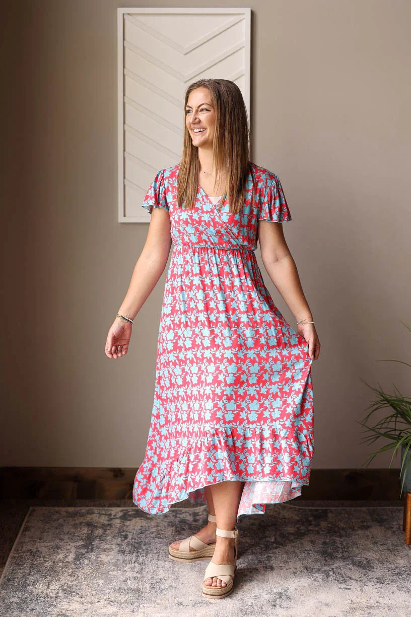 woman wearing red blue floral maxi dress vneck and hi-low for winter retreat outfits