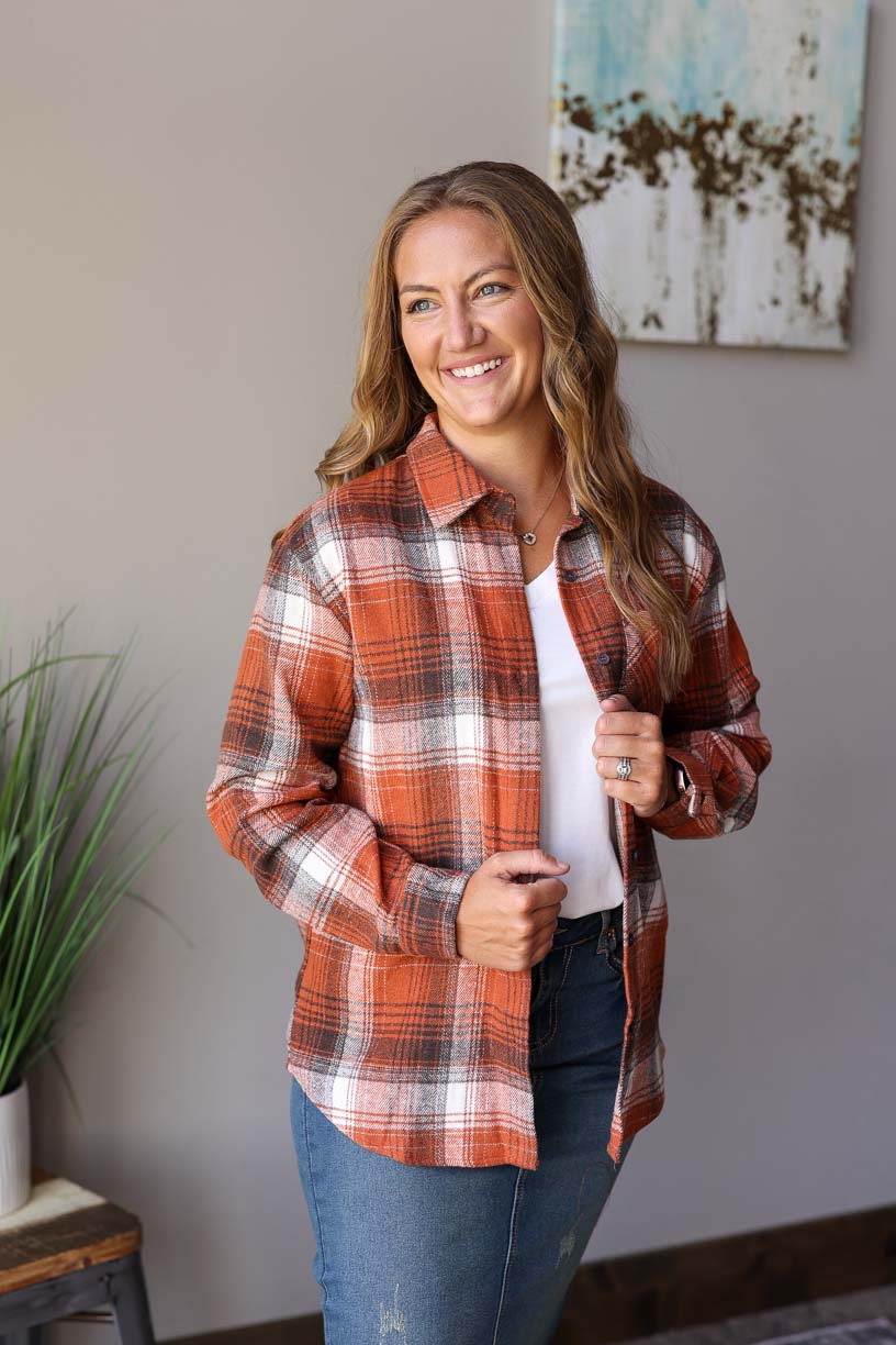 Keep cozy in style with this rust plaid button-up shacket top! Classy Closet Women's Fall Winter Fashion Style Online Boutique