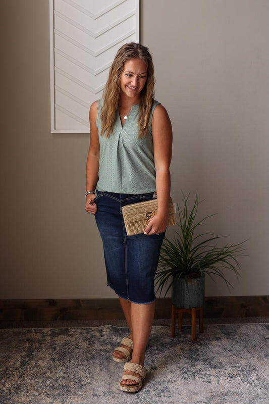 Update your summer wardrobe with our Mist Green V-Neck Tank Top. This cute and chic piece is perfect for any occasion - whether it's a day at work, date night, or a brunch with friends. Made with a soft mist green fabric and feminine eyelet texture, it's stylish and versatile for any setting. Don't miss out on this must-have addition to your closet. Classy Closet online women's clothing boutique for modest fashion in rock valley iowa