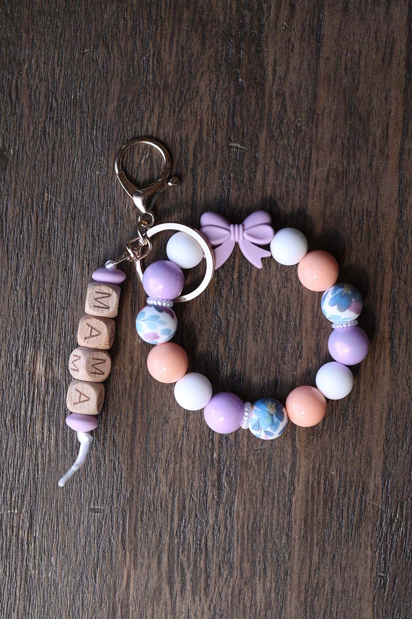 Mama Purple Bow Silicone Bead Wristlet

Great gift for her!
