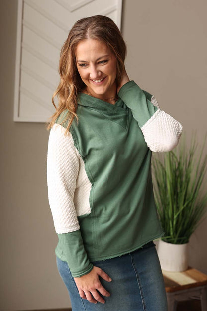 Stay on trend and look effortlessly cute with our Mist Green Contrast Sleeve Colorblock Hoodie. The mist green color is perfect for adding a fresh touch to your wardrobe while the ivory quilted detail adds a pop of fun and texture. Ideal for everyday casual outfits, this hoodie is a must-have for any cute and easy style fashionista! Classy Closet, top boutique for modest trendy women's clothing for casual outfits