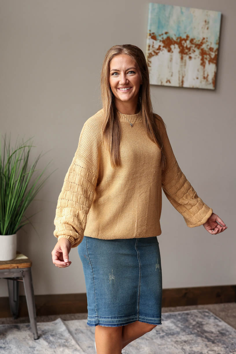 Made with soft knit fabric and featuring balloon sleeves with a square texture, this chic and comfortable sweater is perfect for date nights and office days alike. Classy Closet Online Women's Boutique for Chic Modest Casual Outfits