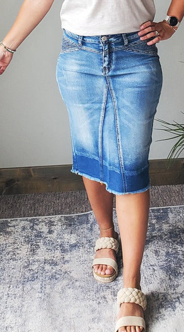 Update your wardrobe with the Zoe Blush Blue Midi Denim Skirt. Its moto side insert detail and contrast hem color add a stylish touch to your everyday look. Perfect for school and busy moms alike. Get yours today! Modest denim skirts for Christian moms and everyday skirt outfits from Classy Closet Boutique